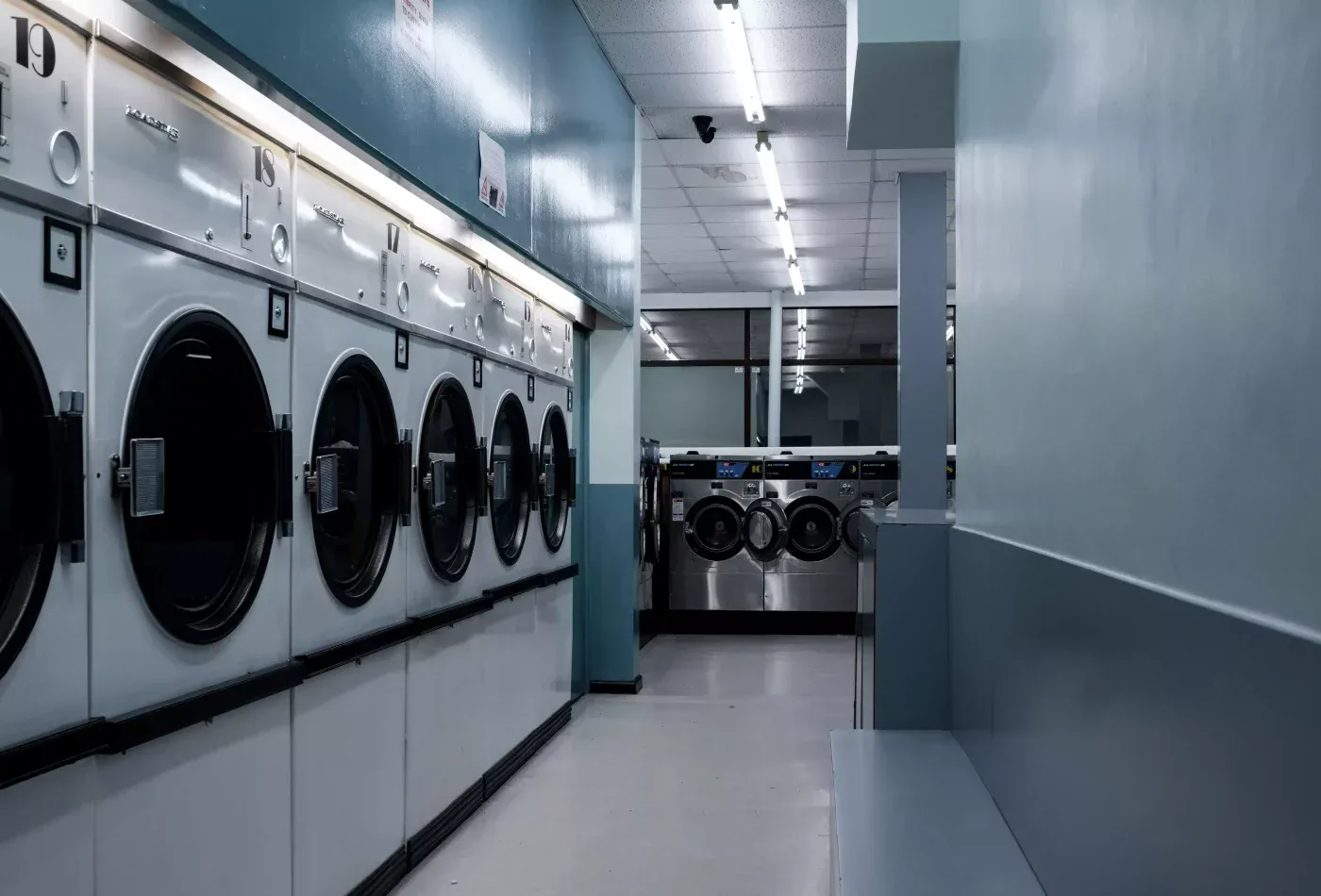 Commercial gas-fired laundry equipment representing specialist laundry training